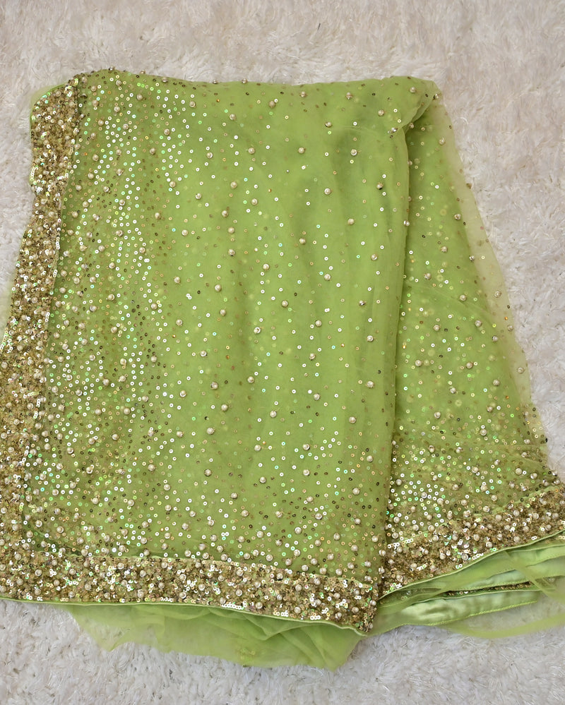 Prisha – Lime Green Net Saree with Gold Full-Sleeve Blouse